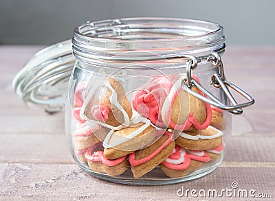 A glass Jar with homemade heart shaped cookies Stock Photo
