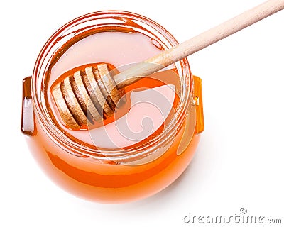 Glass jar of honey with wooden drizzler Stock Photo