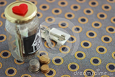 Money jar with house keys Stock Photo
