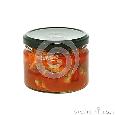 Glass jar of preserved fish a tomato isolated on w Stock Photo