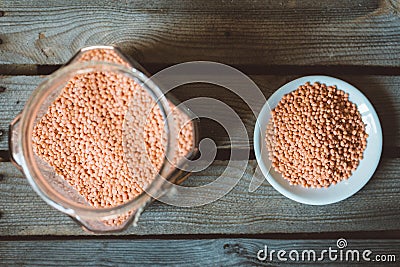 Glass jar with reg orange lentil Stock Photo