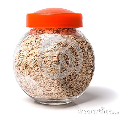 Glass jar with rolled oats on white background glass jar oatmeal flakes isolated Stock Photo