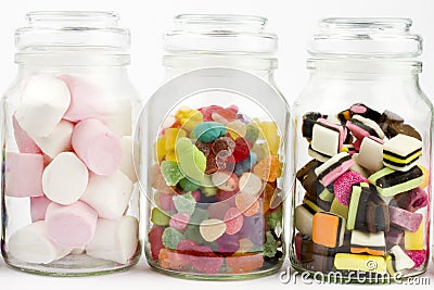 Glass jars filled with sweets mixture Stock Photo