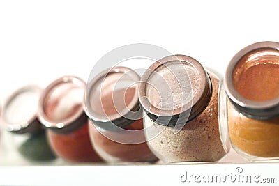 Glass jars with spices in powder, colorful spices, transparent spice containers Stock Photo
