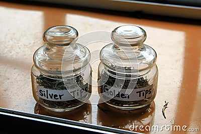 Glass jars with tea. Golden tea. Silver tea Stock Photo