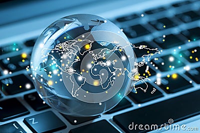 Glass globe on laptop background close up Stock Photo