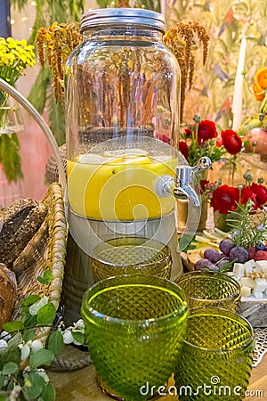 Glass lemonade dispenser Stock Photo