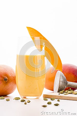 Glass Of Mango Smoothie Decorated With Fruit Slice Stock Photo