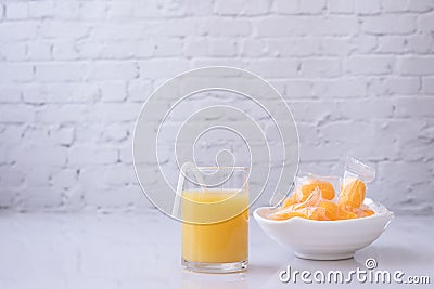 Kitchen table with glass of mangoes juice and mangoes jelly Stock Photo