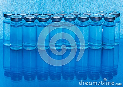 Glass medical ampoule vial for injection. Medicine is liquid sodium chloride with of aqueous solution in ampulla. Close Stock Photo