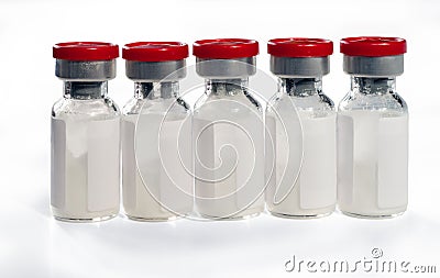 Glass medical vials of biotech drugs with red caps. Isolated on white background Stock Photo