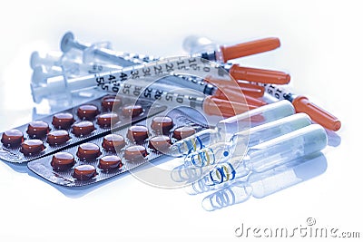 Glass Medicine Vials with syringe pills capsule Stock Photo