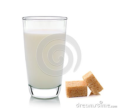 Glass of milk and cubes of cane sugar Stock Photo