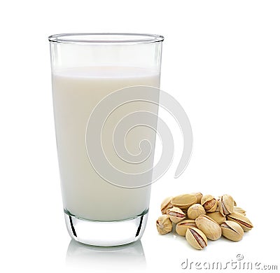 Glass of milk and toasted pistachios on white backgroun Stock Photo