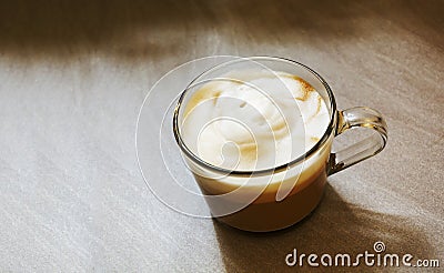 Glass mug with foamy cappuccino Stock Photo