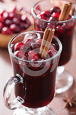 Glass of mulled wine with cranberry and spices, winter drink Stock Photo