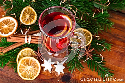 Glass of mulled wine on rustic background Stock Photo