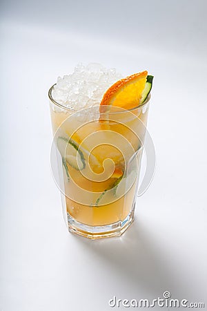 Glass with orange cucumber refreshing drink, rustic style, selective focus Stock Photo