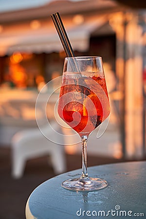 Glass of orange fresh spritz drink cocktail on a beach bar. Food and drink concept Stock Photo