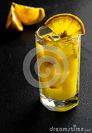 Glass orange juice with ice and slices orange on black background Stock Photo