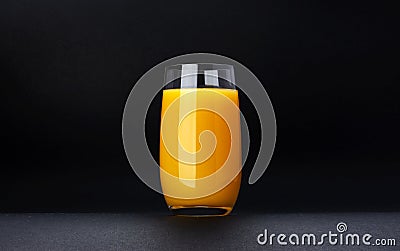 Glass of orange juice isolated on black background with copy space Stock Photo