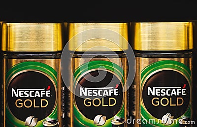 Glass packings of the Nescafe Gold instant coffee by Nestle corp Editorial Stock Photo