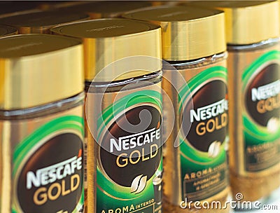 glass packings of the Nescafe Gold instant coffee by Nestle corp Editorial Stock Photo