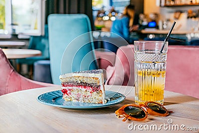 Glass of passionfruit lemonade and cake Stock Photo