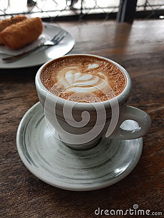a glass of piccolo latte coffee that is beautifully presented Stock Photo
