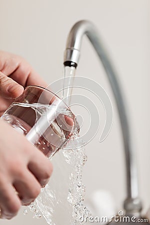 Glass pouring fresh drink water Stock Photo