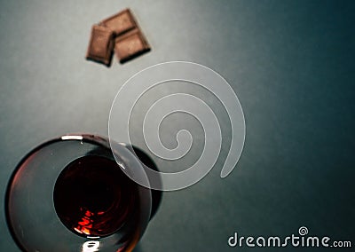 A glass of red wine with chocolate slices Stock Photo