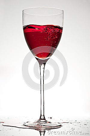 Glass of red wine with bubbles Stock Photo