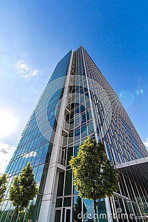 Glass reflective office buildings against blue sky Stock Photo