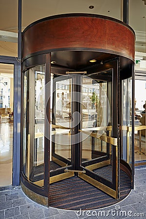 Glass revolving door at Hotel Hilton Grand Place Editorial Stock Photo