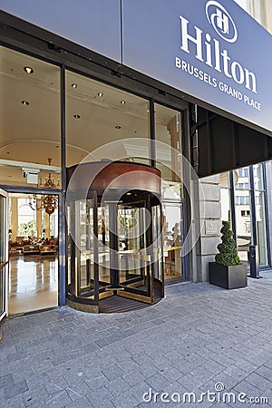 Glass revolving door at Hotel Hilton Grand Place Editorial Stock Photo