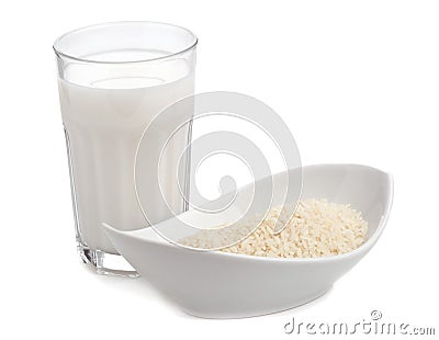 Glass of rice milk with bowl of rice Stock Photo