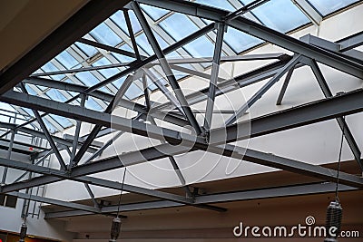 Abstract high-tech architecture. Modern metal building structures. Glass roof from the inside Stock Photo