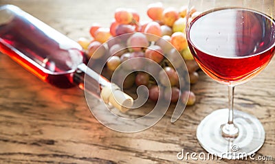 Glass of rose wine with bunch of grape Stock Photo