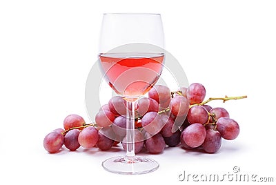 Glass of rose wine with bunch of grapes, isolated on white background. Stock Photo