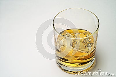 Glass of scotch and ice Stock Photo