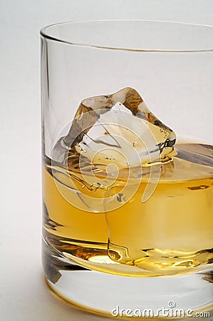 Glass of scotch and ice closeu Stock Photo