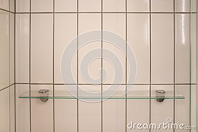 Glass shelf on shower wall. Stock Photo