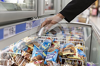 Glass showcase with ice cream. A large assortment. Moscow, Russia, 10-25-2020 Editorial Stock Photo