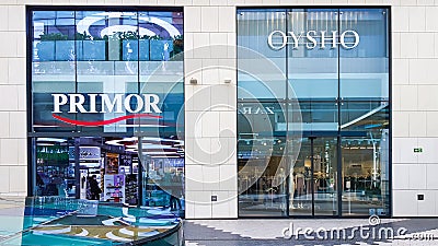 Glass showcases of Oysho and Primor stores in shopping mall Editorial Stock Photo