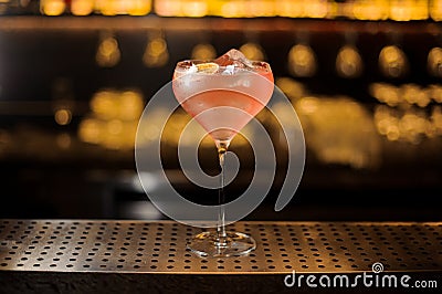 Glass of a Sicilian Tonic cocktail decorated with orange slice Stock Photo