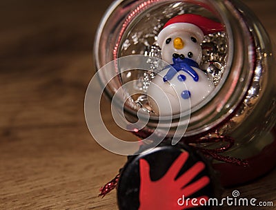 Glass snowman in a glass bottle with pearls Stock Photo