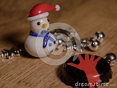 Glass snowman with red cap and blue scarf Stock Photo