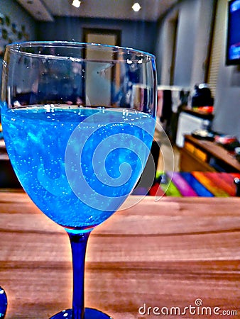 Glass of something blue Stock Photo
