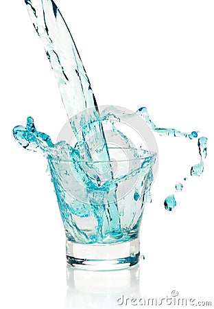 Glass with splashing blue drink Stock Photo