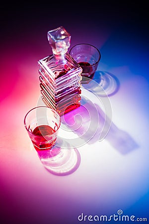 Glass square carafe with liquor Stock Photo